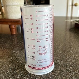 Pampered Chef Measure All Cup - Adjustable Plunger Design